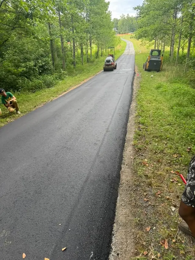 Equipment compacting a new rural road